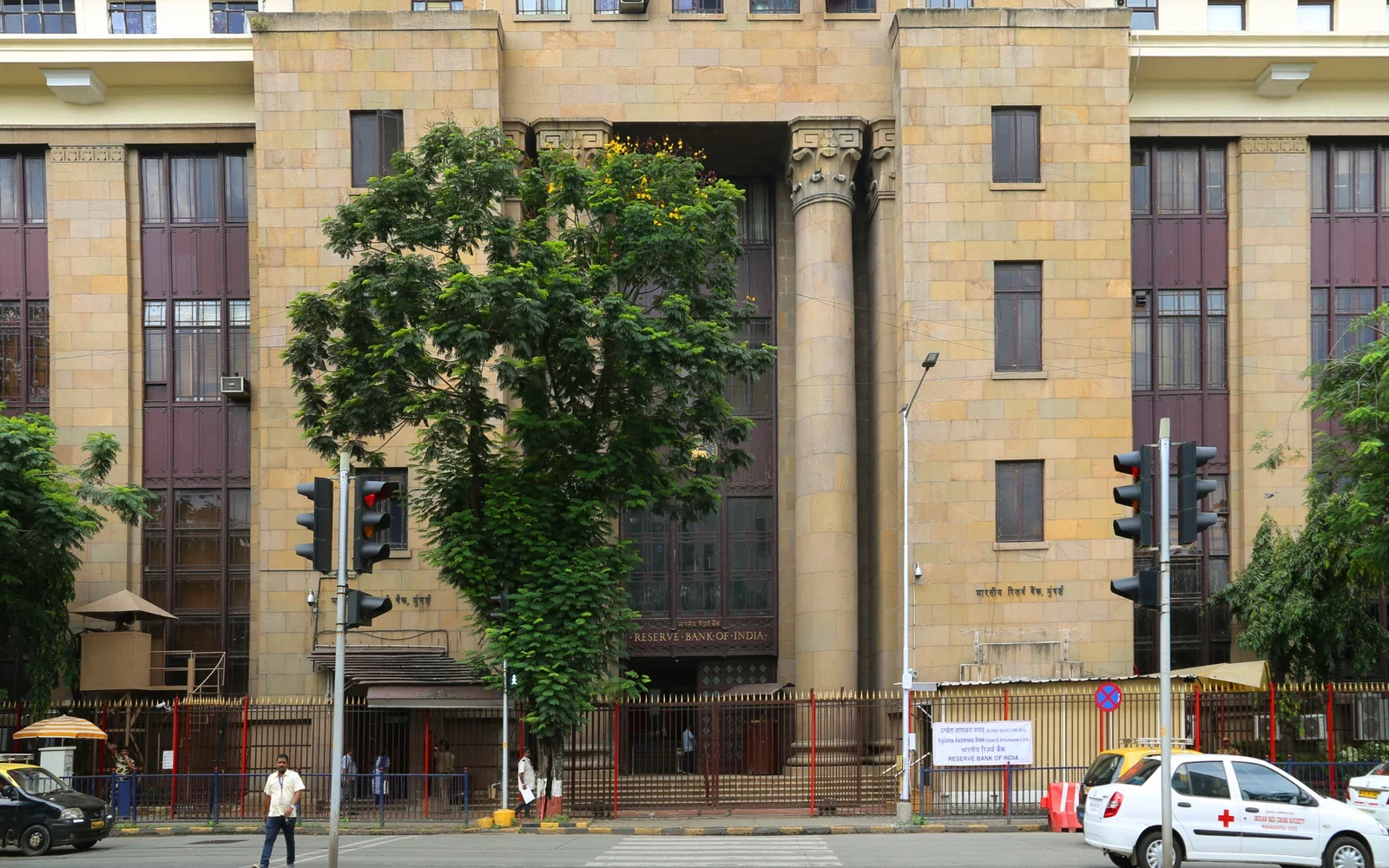 Archival photograph of the Reserve Bank of India building in Mumbai, showing its stone facade and central entrance.